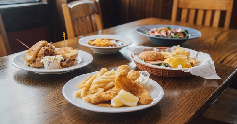 Numerous dishes presented on table, side view
