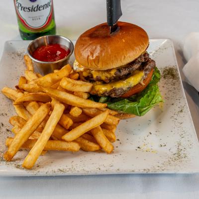 Double burger served with fries and dip.