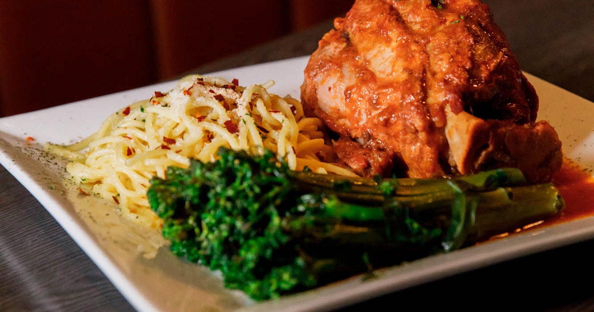 Braised and slow cooked veal shank, served with spaghetti and broccolini