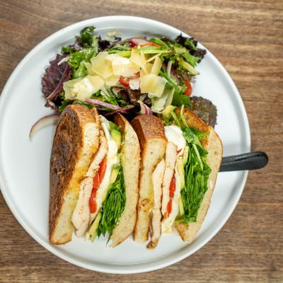 The Aleo, Grilled chicken sandwich served with house salad.