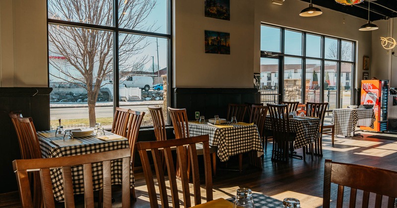 Interior, tables and chairs by the window