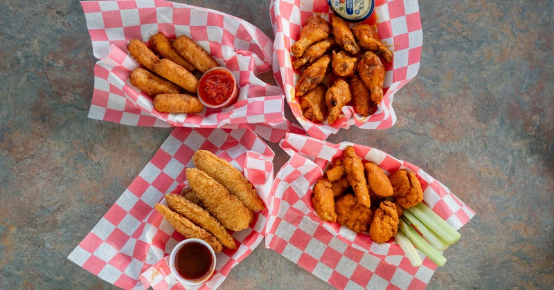 Variety of fried appetizers served with dips and vegetable sticks