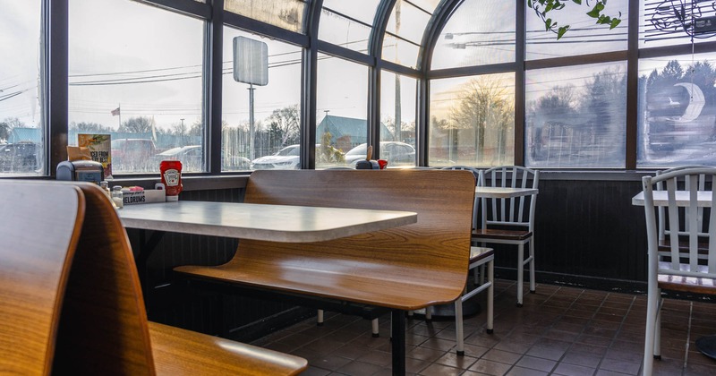 Inside, table with chairs near window