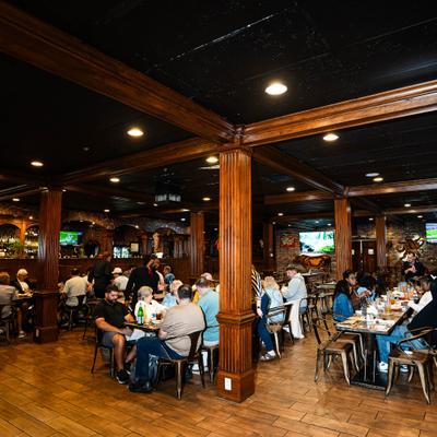 View at the interior with people siting at the tables.