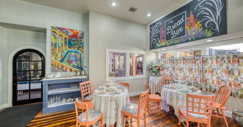 Interior, skirted tables with table items, tea party ambiance
