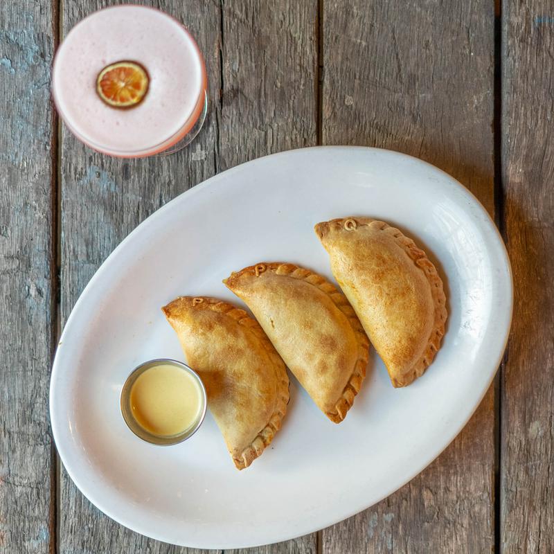 Pork Carnitas, Caramelized Onions, Hominy, Collards photo