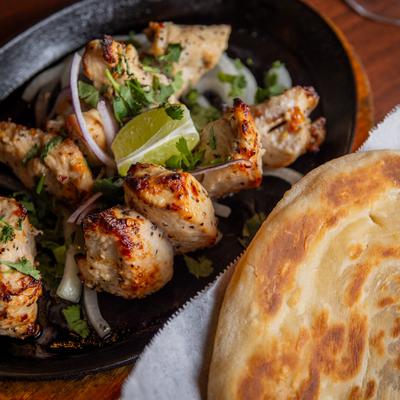 Marinated barbecued chicken, and naan bread.