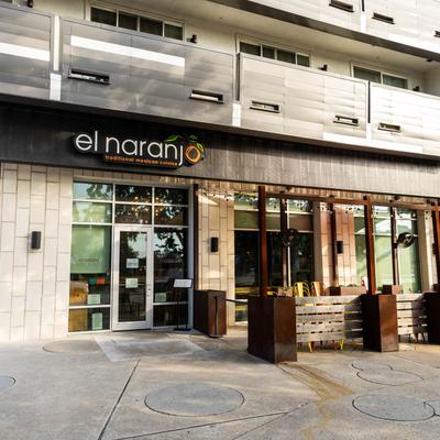 El Naranjo restaurant exterior with signage and outdoor seating.