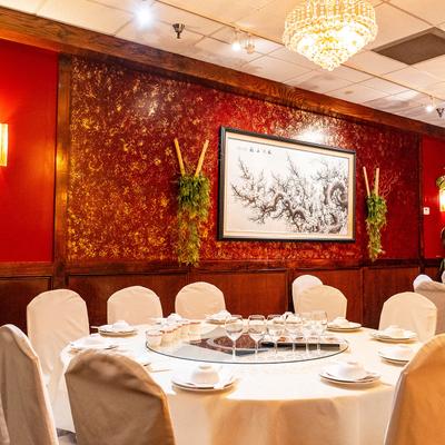 Interior, round tables and chairs, painting on the wall