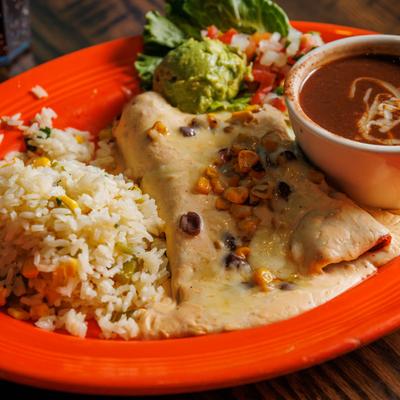 Avocado Enchiladas with rice, guacamole, black bean salsa and fresh salsa