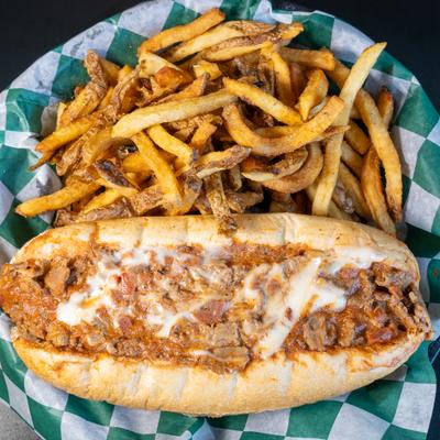 Classic cheesesteak Philly served with fries.