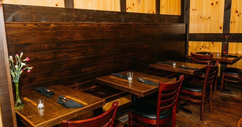 Interior, tables, chairs and high back bench