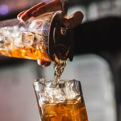 Pouring cocktail in the glass