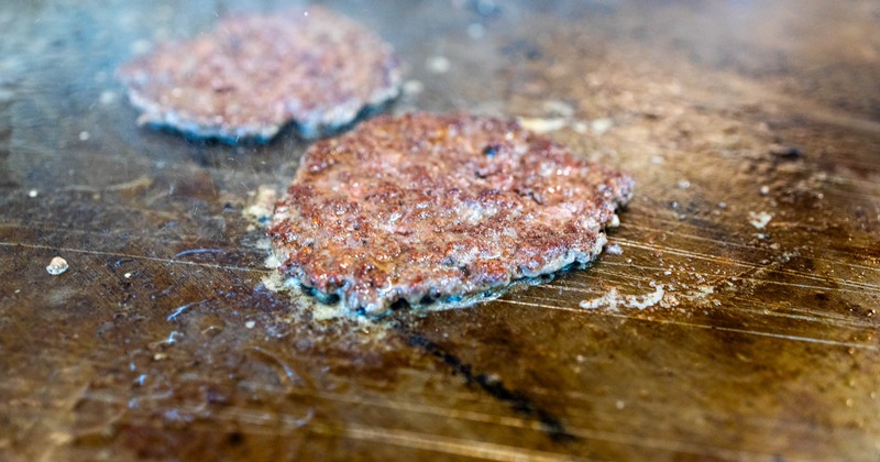 Beef patties cooking