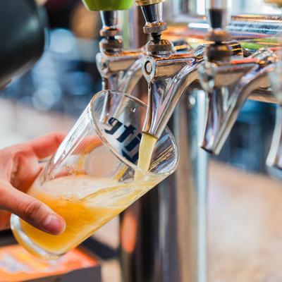 Tap beer being poured into a glass.