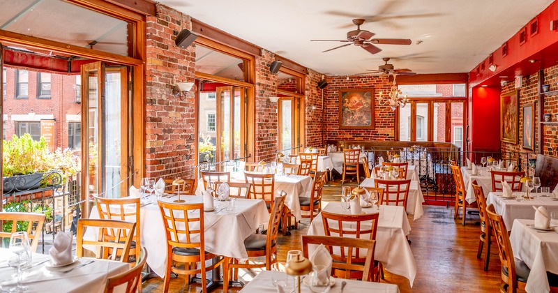 Interior, dining area with tables set for guests