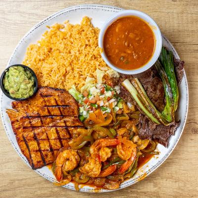 Tres Amigos featuring grilled steak, chicken and shrimp with various sides.