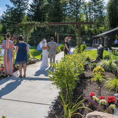 Groom and bride walking towards the restaurant