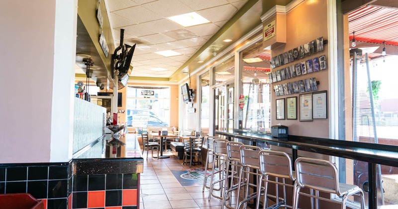 Interior, diner area, counter, tables and chairs, wide view