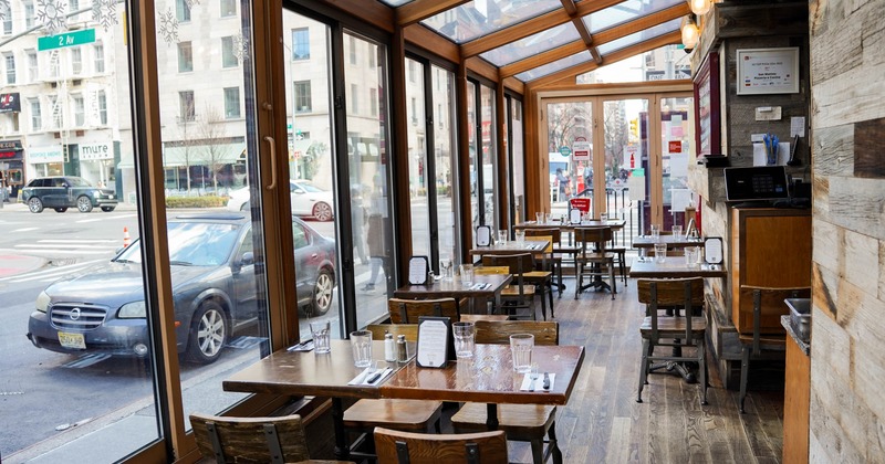 Interior, covered patio with tables and chairs