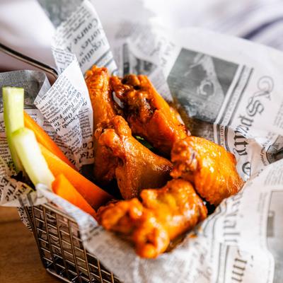 Chicken wings, served.