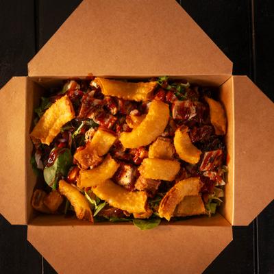 BBQ Chicken Salad, with lettuce, onions, bacon, and onion ring bits.