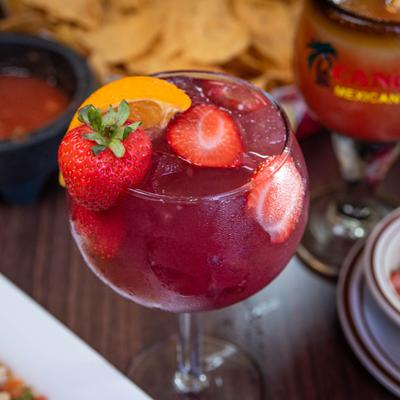 Red Sangria with strawberry slices.