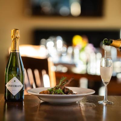 Lamb stew plate served with champagne.