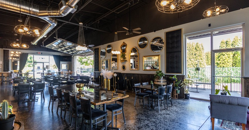 Interior, dark chairs, stylish mirrors, industrial light fixtures