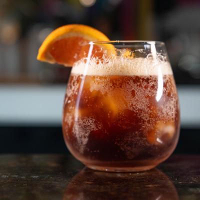 Cocktail with an orange slice.