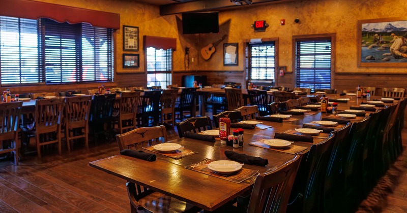 Interior, dining space with wooden tables and chairs