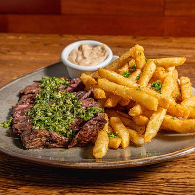 Steak and fries with chimichurri.