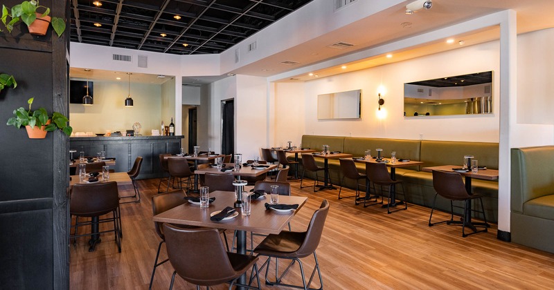 Interior, dining area with tables set for guests