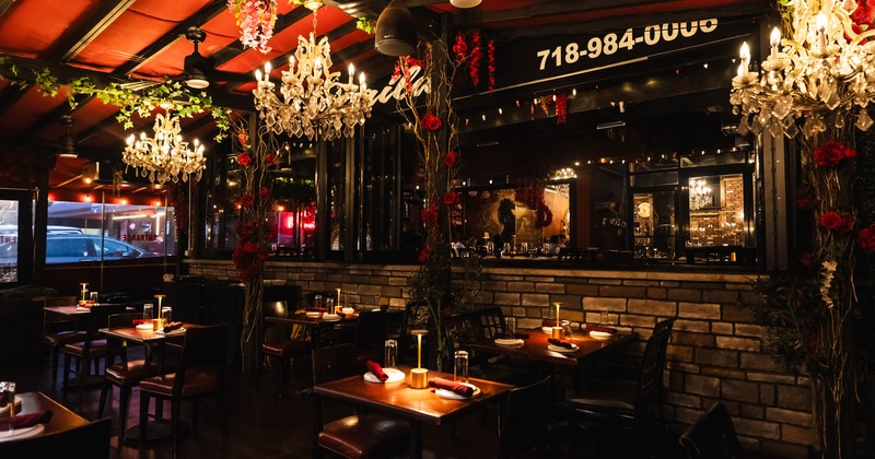 Elegant restaurant interior with chandeliers and floral decor