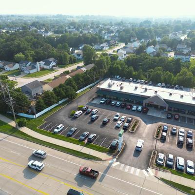 Aerial view of a shopping center and vicinity.