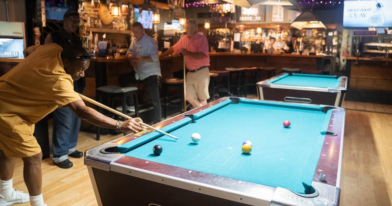 Interior, guests playing pool