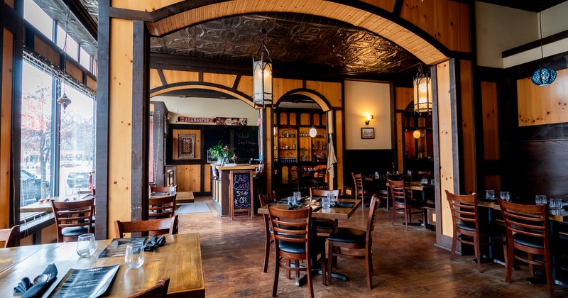 Interior, seating area with wooden tables and chairs