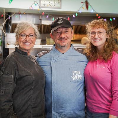 Owners and the chef posing for a shot inside the restaurant.