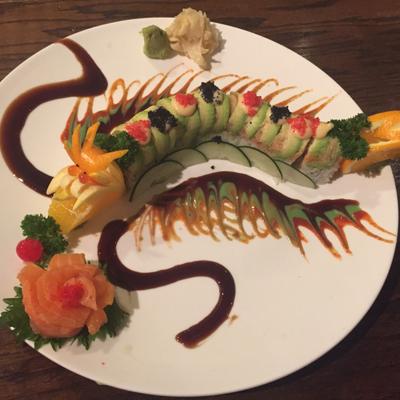 Sushi rolls formed into the shape of a dragon.