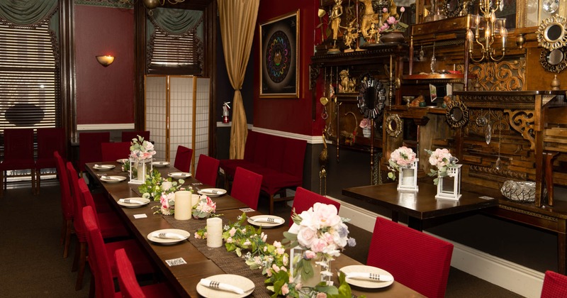 Restaurant interior, big dining table ready for guests