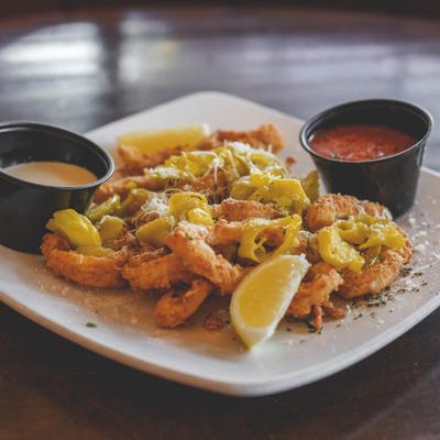 Fried calamari topped with green pepperoncini, served with lemon wedges & two dipping sauces