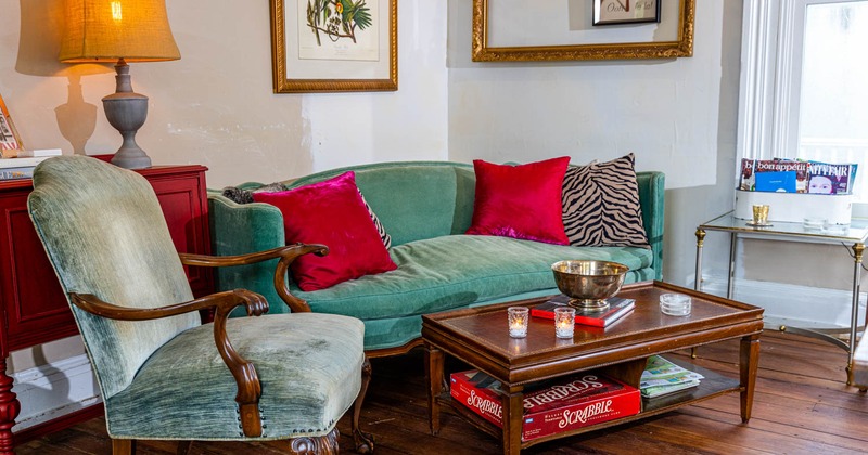 Interior, upholstered sofa and armchair with a coffee table in a corner of the room