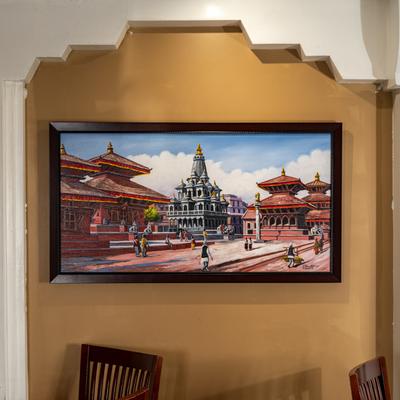 Painting of Nepal Temple Town Scene on a wall in a dining room.
