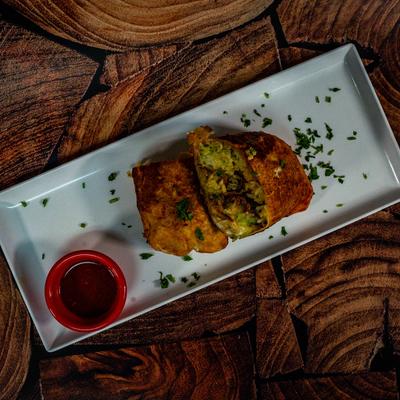 Burrito served with dipping sauce.