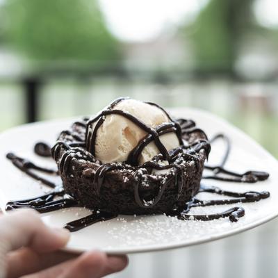 Brownie, plate in a hand.
