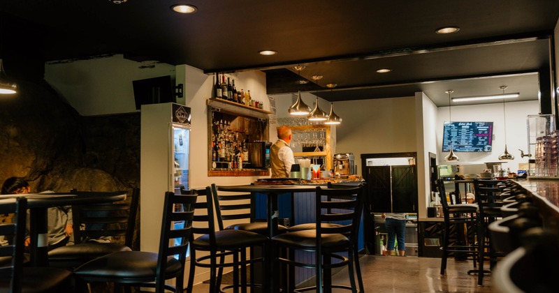 Seating area, tall tables and stools