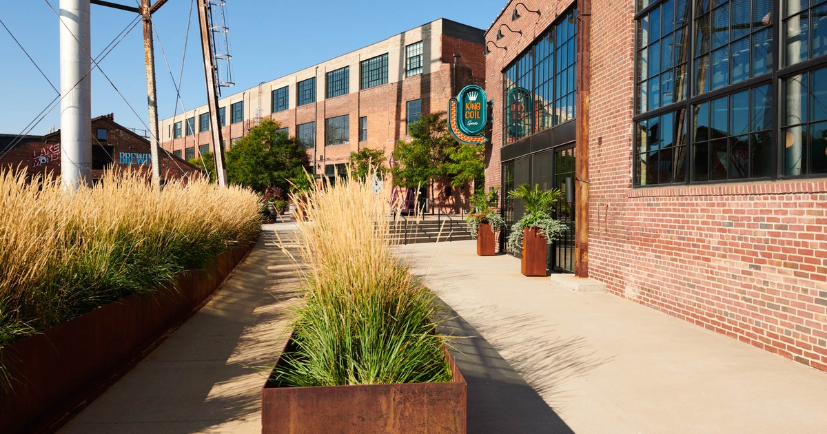 King Coil Spirits exterior with signage and a red brick facade