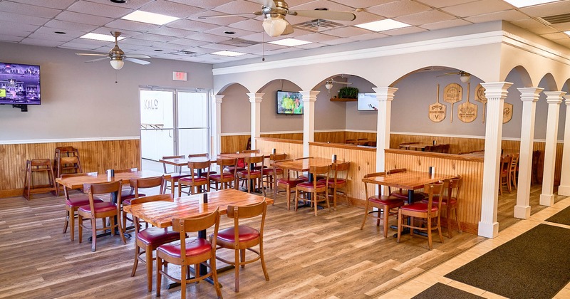 Interior, spacious dining area with tables and chairs
