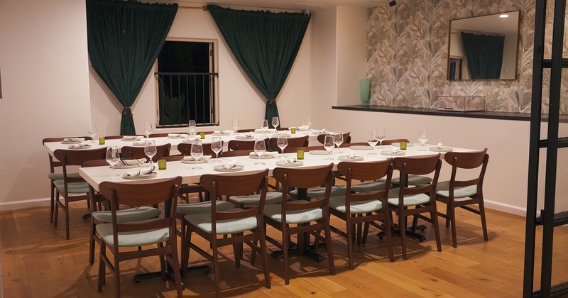 Interior, room for private events with set tables