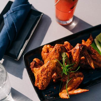 Fried chicken wings and Spicy Blood Orange Margarita
